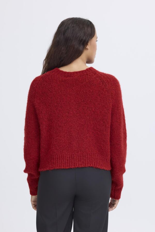 Roter Strickpulli mit Knöpfen